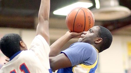 Roosevelt's Latrell Hollis goes for the basket during