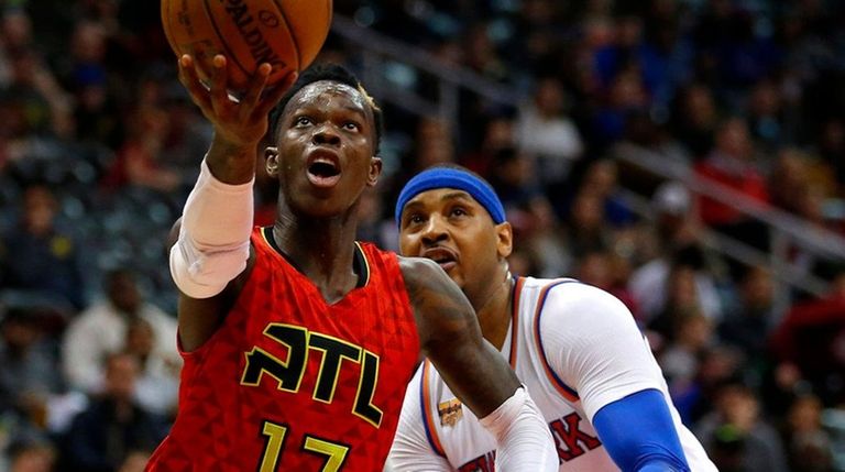 Atlanta Hawks guard Dennis Schroder drives to the