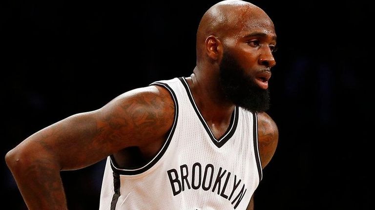 Quincy Acy of the Brooklyn Nets looks on