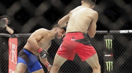 Chan Sung Jung of South Korea fights Dennis