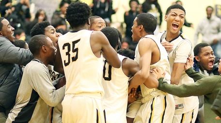 Team and fans on court after Uniondale's Danny