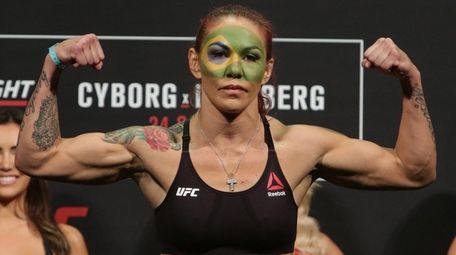 Cris Cyborg Justino poses during the weigh-in for her