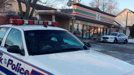 Suffolk County police investigate a robbery at a 7-Eleven