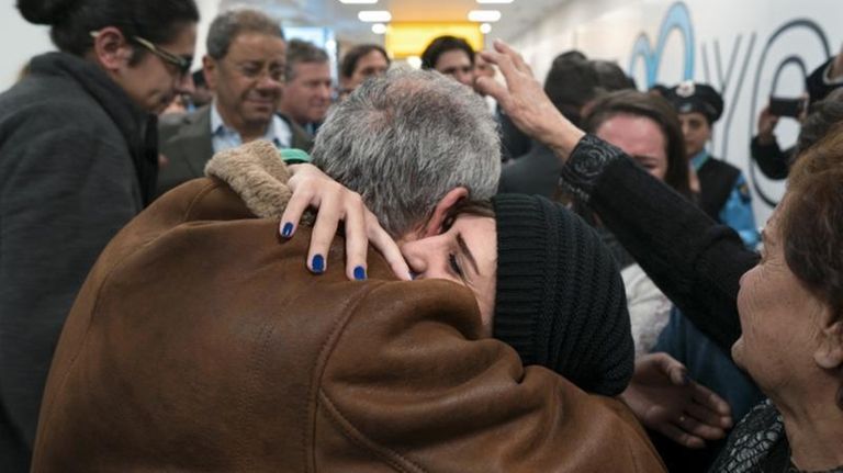 Family members who have just arrived from Syria