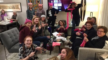 Pierson Feminists United club members and advisors knit