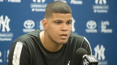 New York Yankees' pitcher Kellin Betances holding a