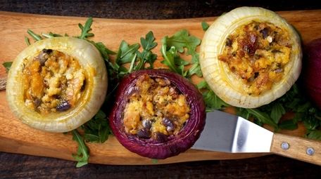 Onions stuffed with herbs and cheese.