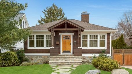 This custom Craftsman home in Huntington is on