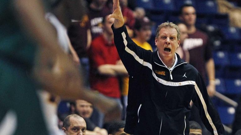 Iona head coach Tim Cluess calls to his
