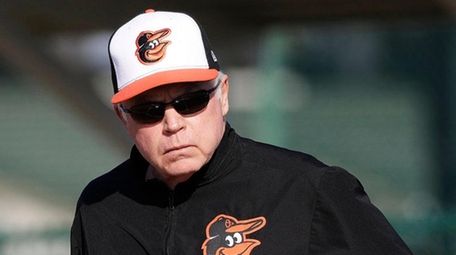 Baltimore Orioles manager Buck Showalter walks on the