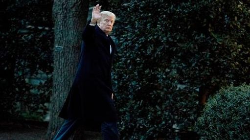 President Donald Trump waves as he arrives at