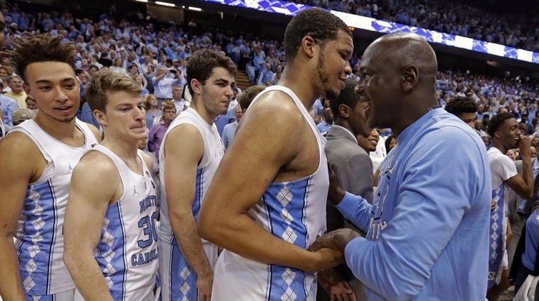Former North Carolina basketball player Michael Jordan, right,