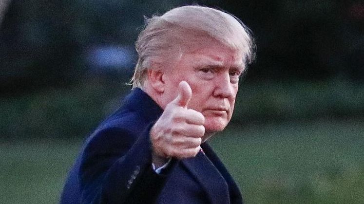 President Donald Trump walks across the South Lawn