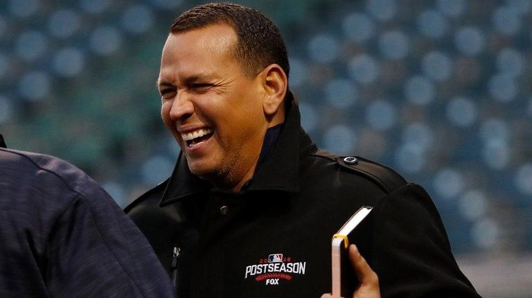 Cleveland Indians coach Sandy Alomar Jr. (L) and