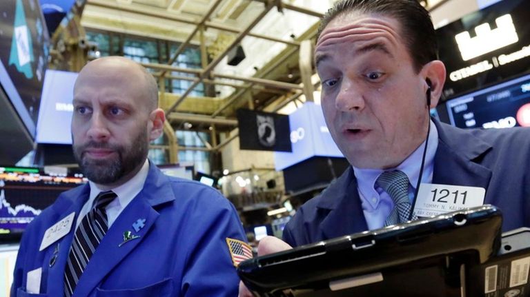 Specialist Meric Greenbaum, left, and trader Tommy Kalikas