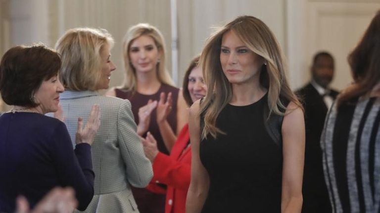 First lady Melania Trump walks into the State