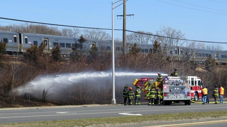 A brush fire along the Long Island Rail