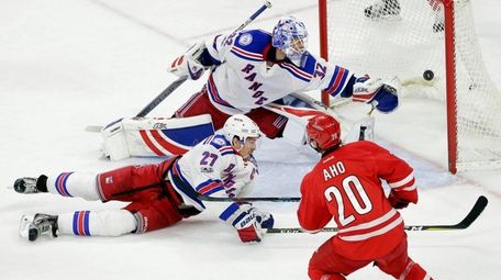 Carolina Hurricanes' Sebastian Aho (20), shoots the winning