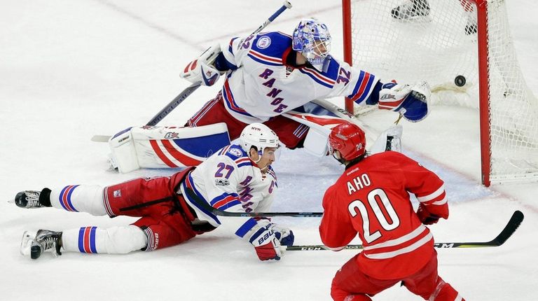 Carolina Hurricanes' Sebastian Aho (20), shoots the winning