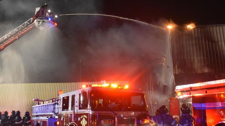 Firefighters battle a blaze at the former Lawrence