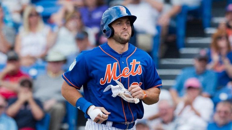 Mets designated hitter Tim Tebow makes his way