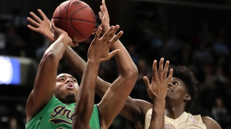 Notre Dame forward Bonzie Colson (35) puts up