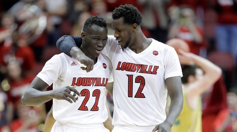 Deng Adel #22 and Mangok Mathiang #12 of