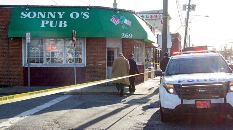 Nassau police investigate a crime scene on West