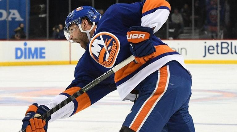 New York Islanders defenseman Johnny Boychuk shoots the