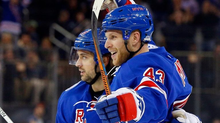 Steven Kampfer, right, of the New York Rangers