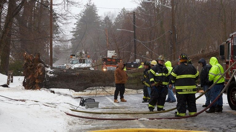 Firefighters and emergency personnel work at the scene