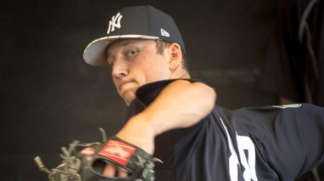 New York Yankees pitcher James Kaprielian throws in the bullpen
