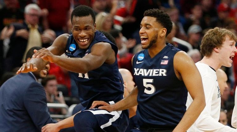 Xavier guard Malcolm Bernard, left, and guard Trevon