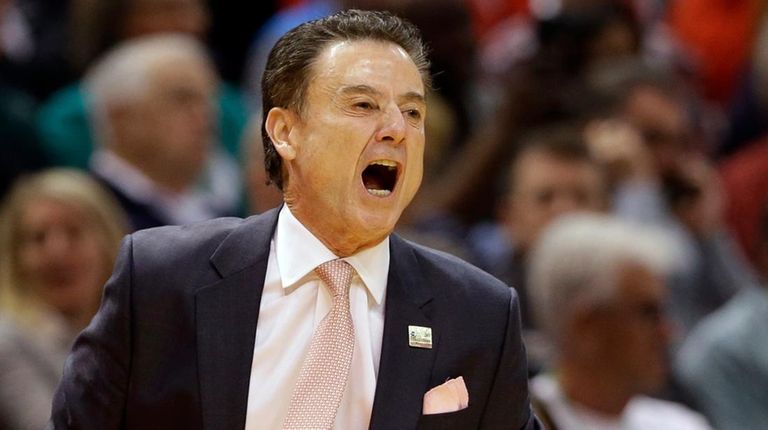 Louisville head coach Rick Pitino yells to his