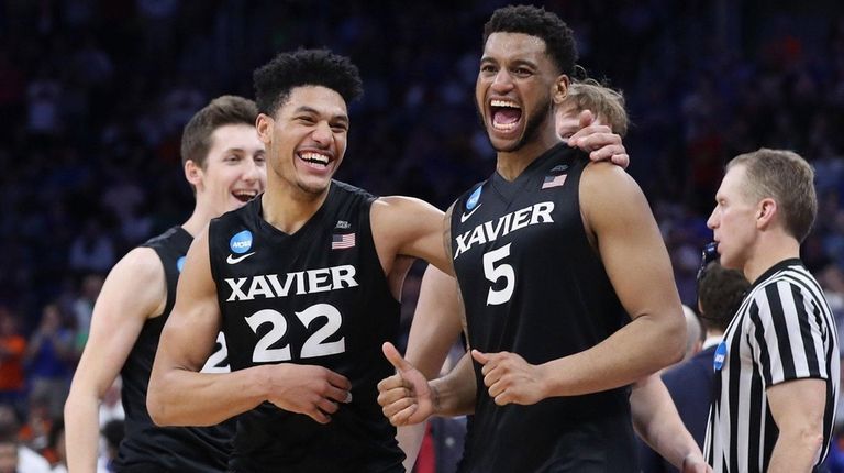 Kaiser Gates, left, and Trevon Bluiett of