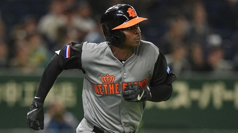 Netherlands' Didi Gregorius runs the bases following his three-run