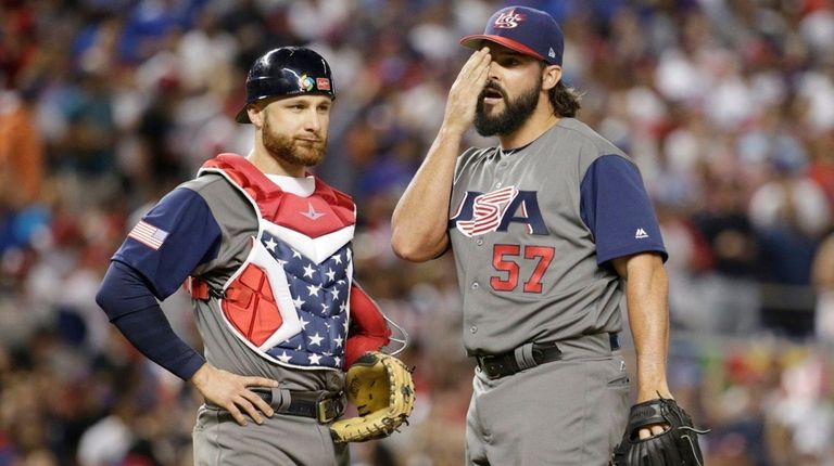U.S. relief pitcher Tanner Roark stands on the