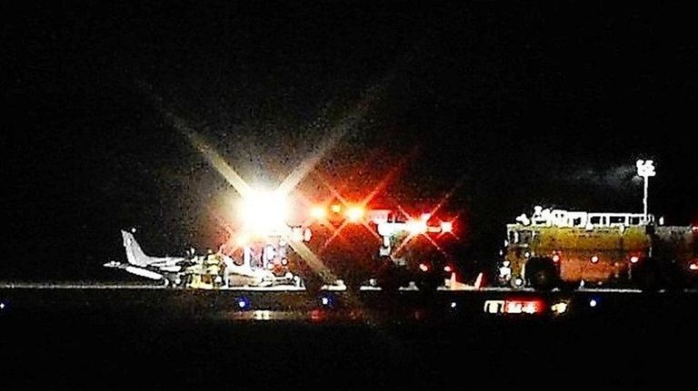 A twin-engine plane landed hard on its belly
