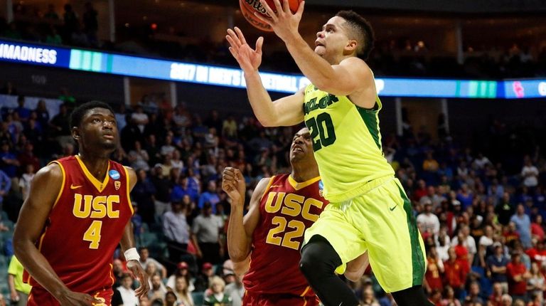 Baylor guard Manu Lecomte goes for a layup