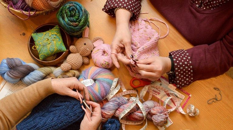 Ruth Kerekes (left), of Stony Brook, practices knitting