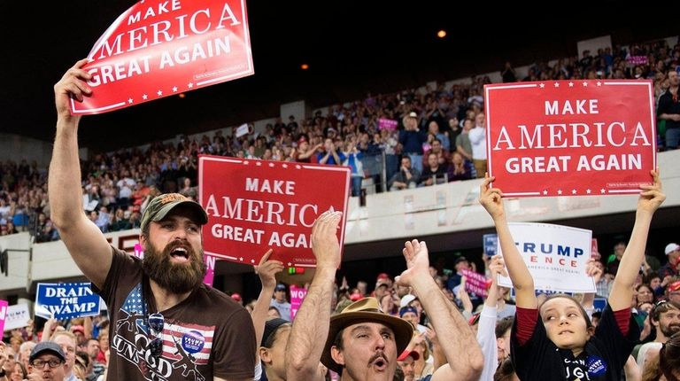Supporters cheer for President Donald Trump as he