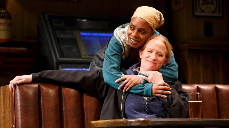 Michelle Wilson, standing, and Johanna Day play blue-collar
