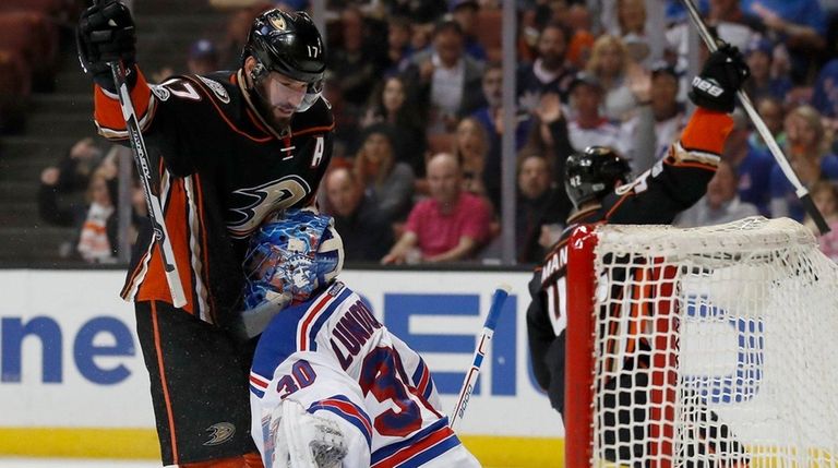 Anaheim Ducks center Ryan Kesler, left, runs into