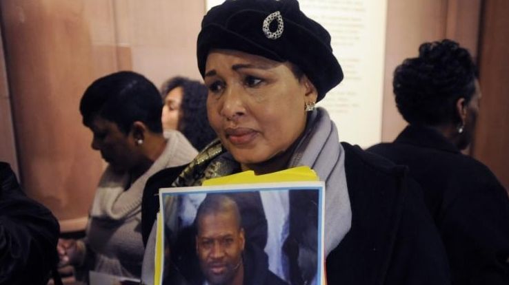 Hawa Bah, mother of Mohamed Bah, holds a