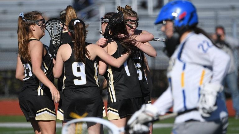 Sachem North players celebrate a goal by Hailey
