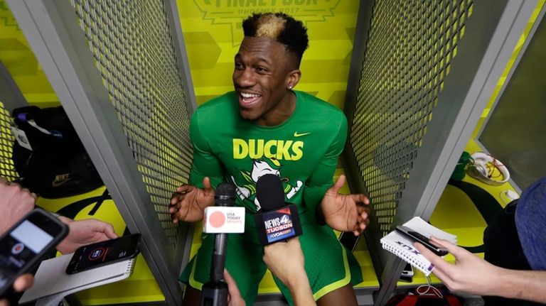 Oregon's Dylan Ennis answers questions after a practice