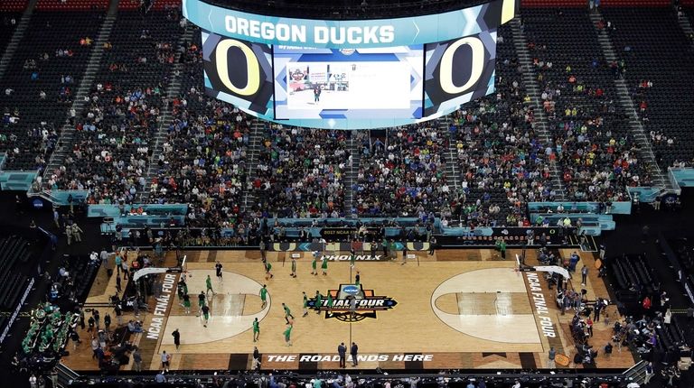 Oregon players warm up during a practice session