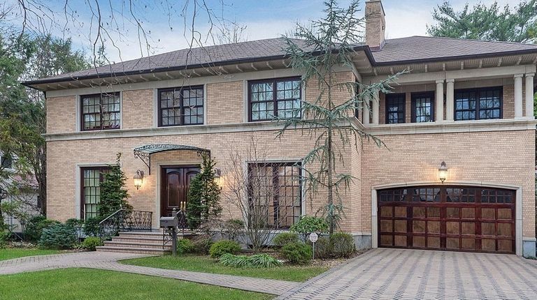 This Garden City Colonial-style manse includes an indoor