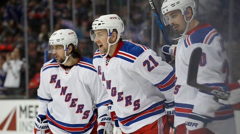 New York Rangers center Derek Stepan, center, celebrates