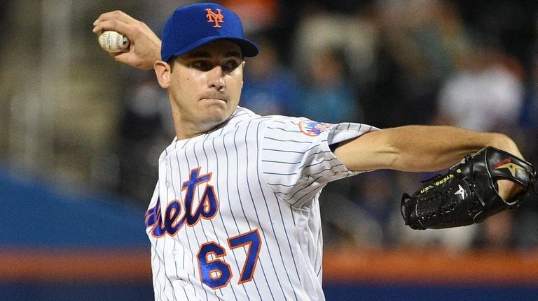 New York Mets starting pitcher Seth Lugo delivers